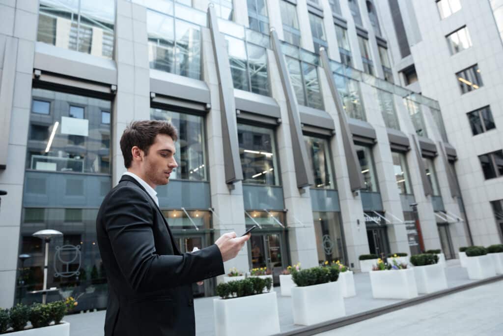 Man using smartphone center.